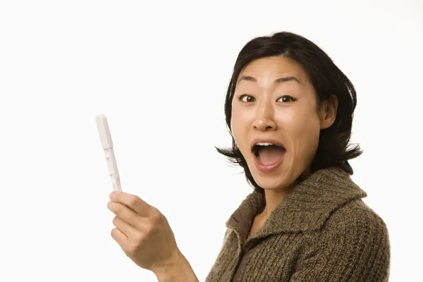 Woman holding pregnancy test. — Stock Photo, Image