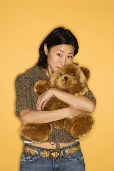 Woman holding teddy bear. — Stock Photo, Image