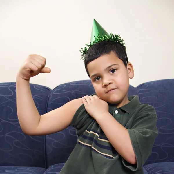 Boy flexing arm muscle. — Stock Photo, Image