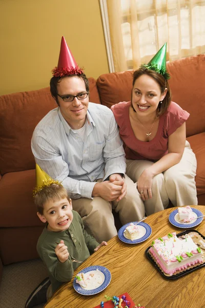Family eating birthday cake. — Stock Photo, Image