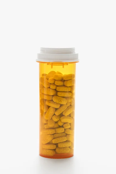 Bottiglia piena di pillole. Isolato — Foto Stock