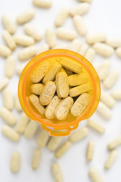 Frasco de pílula aberta com comprimidos — Fotografia de Stock