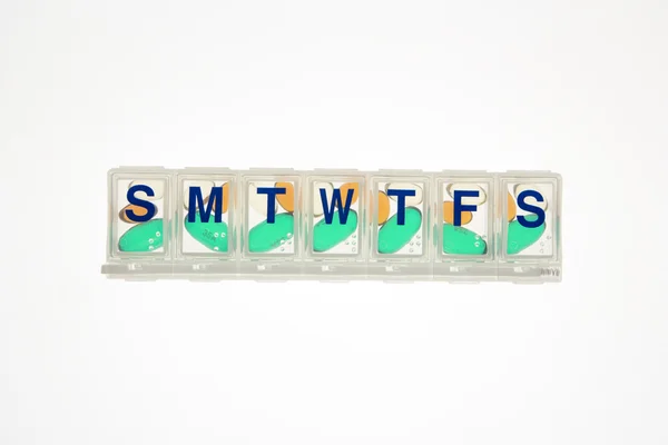 Pills in Closed Pill Organizer. Isolated — Stock Photo, Image