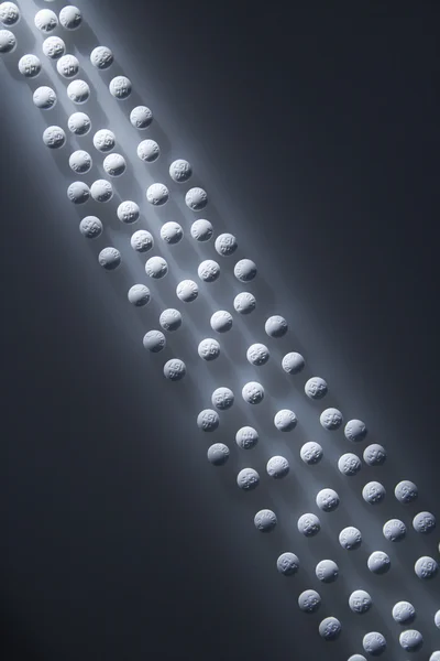 Lined Up White Pills — Stock Photo, Image