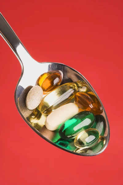 Spoonful of Pills. Isolated — Stock Photo, Image