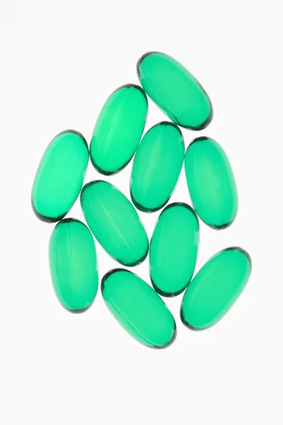 Zelené vitaminu kapsle — Stock fotografie