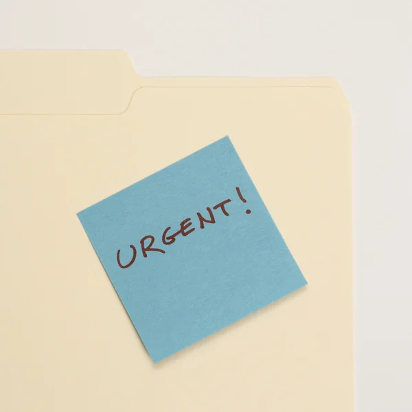 Urgent sticky note. — Stock Photo, Image