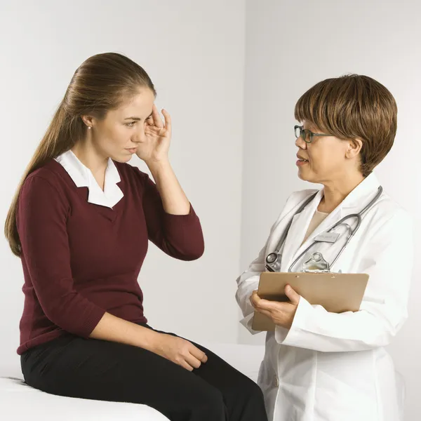 Doctor examining patient. Royalty Free Stock Images