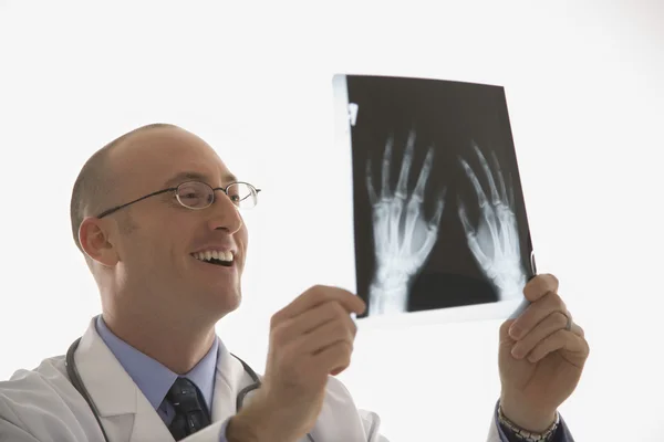 Doctor looking at xrays. Stock Image
