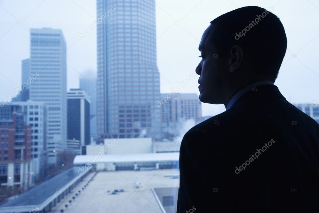 Businessman Looking Through a Window