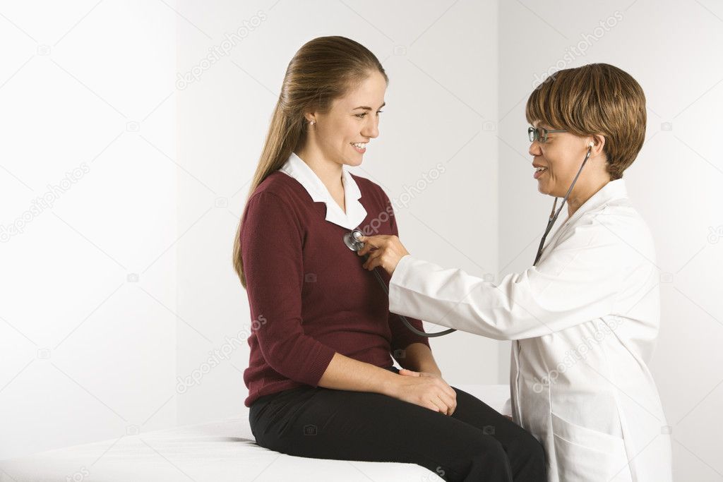 Doctor examining patient.