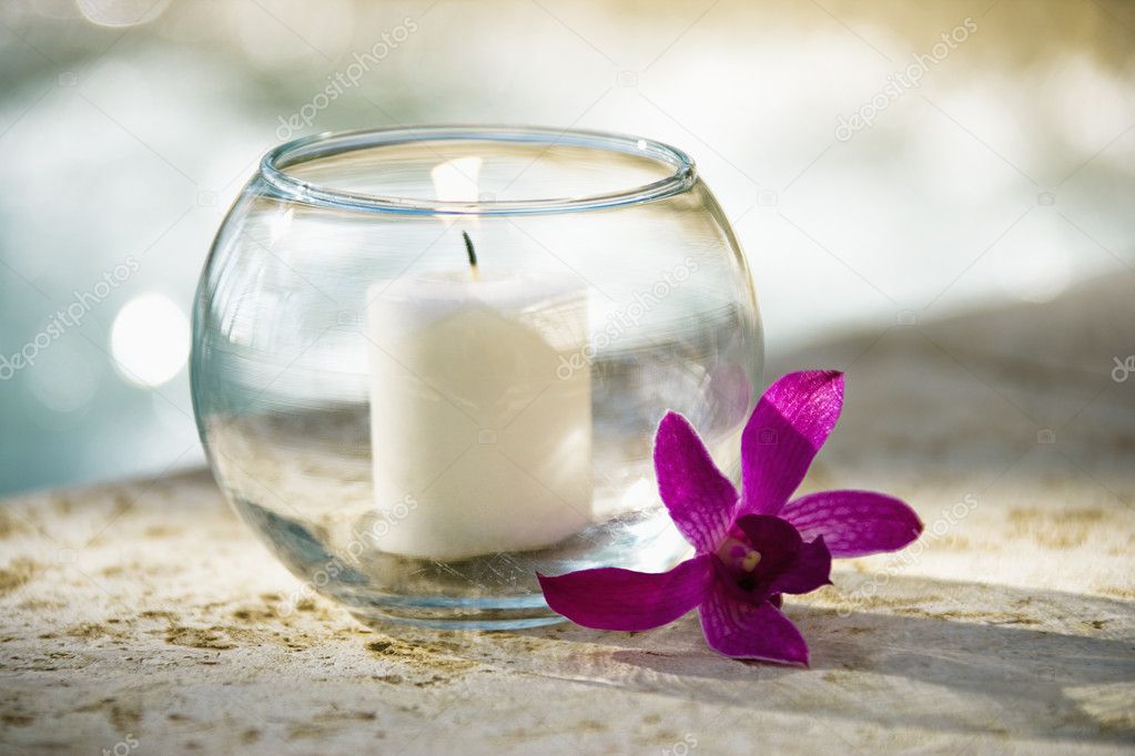 Candle and orchid.