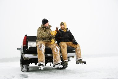 Two Men Having a Beer On Truck clipart