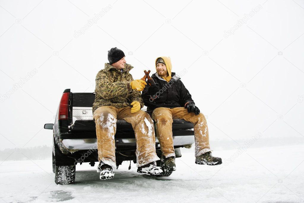 Two Men Having a Beer On Truck