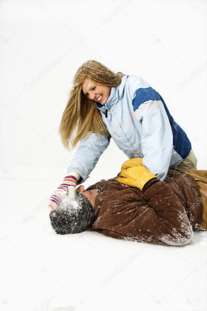 Young Couple Playing in Snow