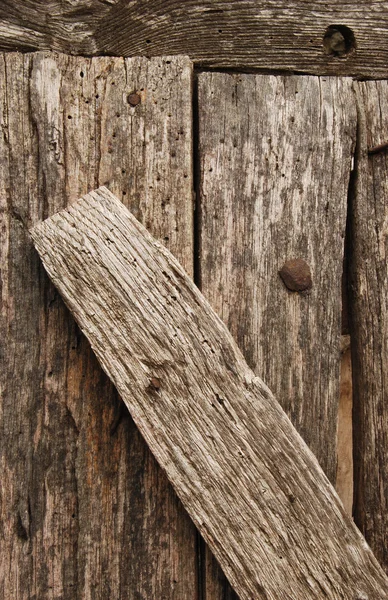 Alte genagelte Holzbretter — Stockfoto