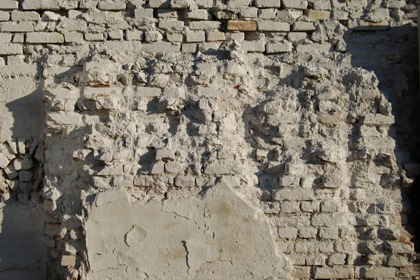 Jagged white painted brick wall — Stock Photo, Image