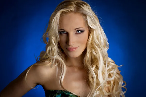 Portrait of a smiling blond lady with a beautiful hair