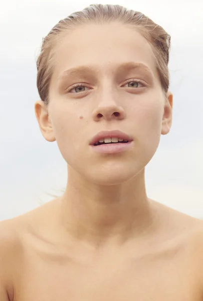 Portrait of beautiful female model with blue eyes on background — Stock Photo, Image