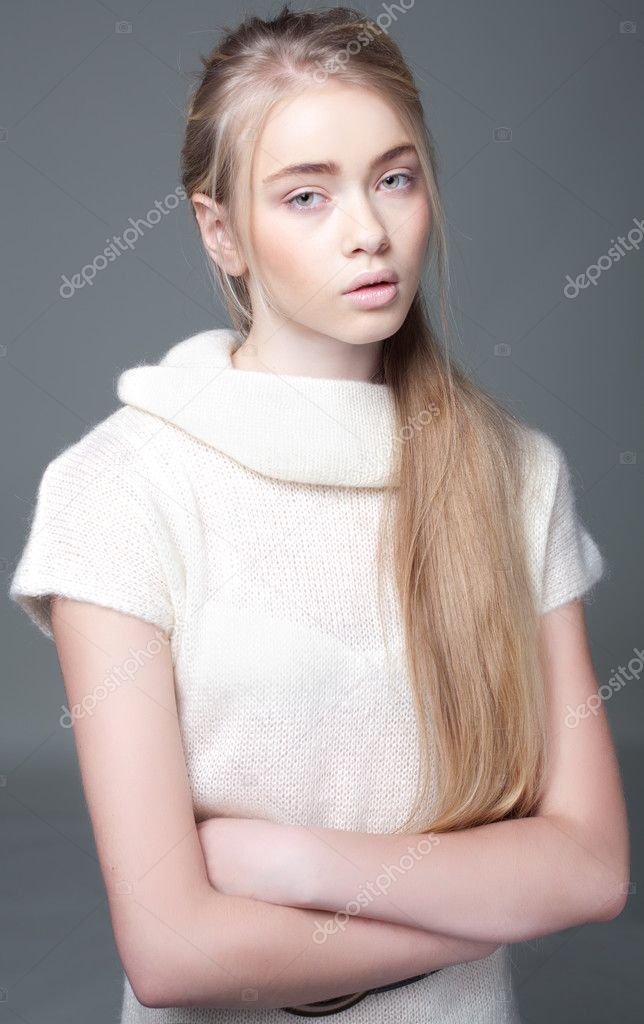 Portrait of a beautiful teenager girl with long hair in studio