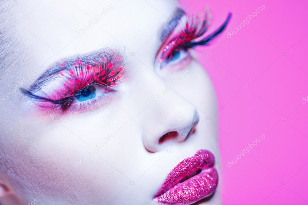 Close-up of beautiful woman face with Creative Fashion Art make