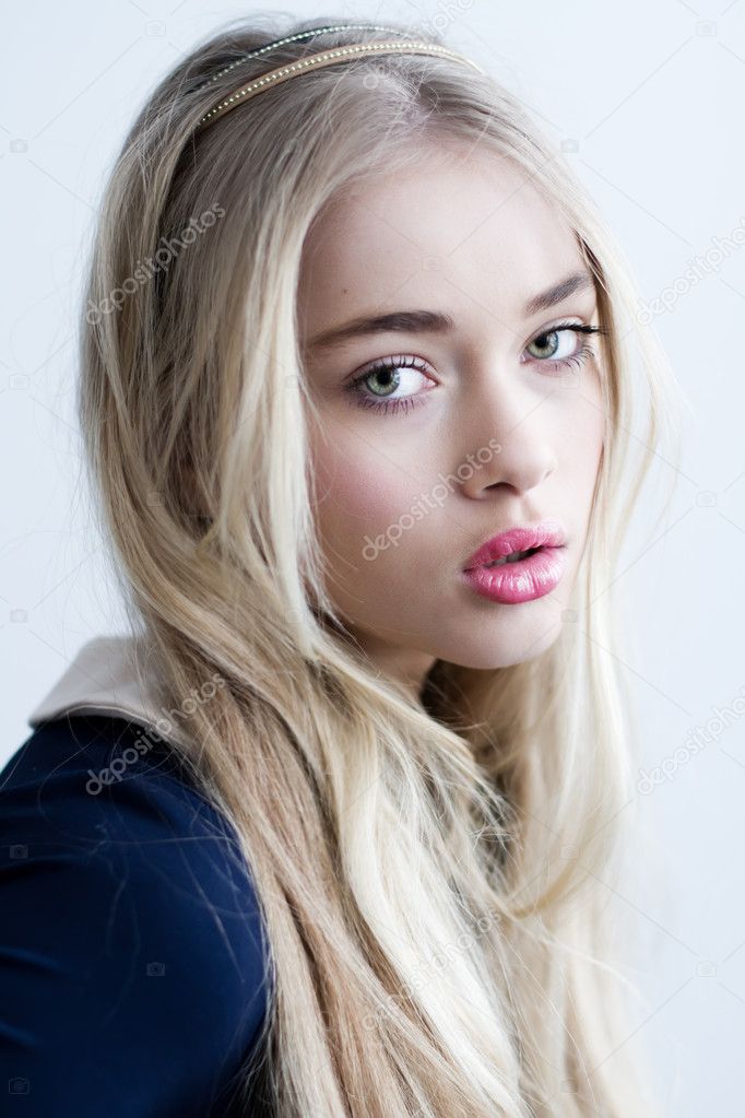 Beautiful blonde girl with long hair and green eyes Stock Photo by ©tarasla  8893800