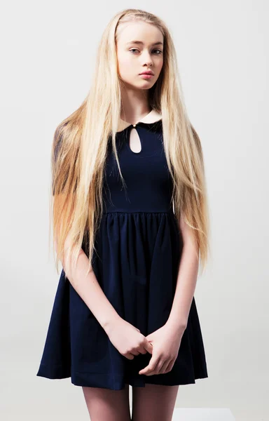 Fashion teen female model in dress in studio — Stock Photo, Image
