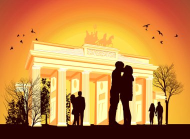 Couple kissing in the background of Brandenburg Gate clipart