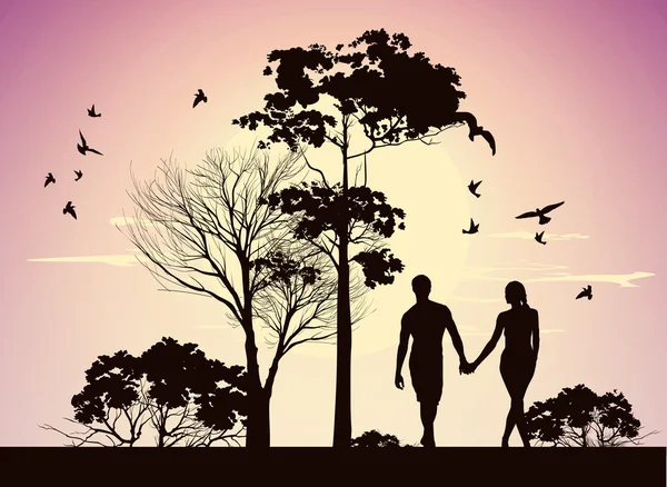 Man en vrouw hand in hand en wandelen in het park — Stockfoto