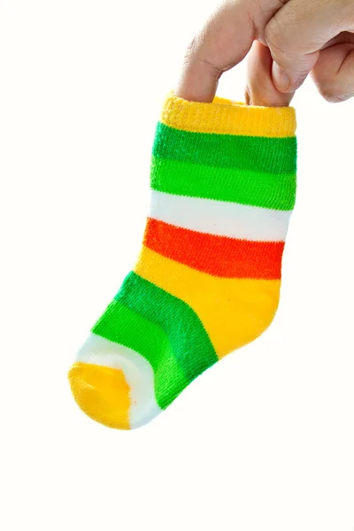 One baby sock in woman's hand. — Stock Photo, Image