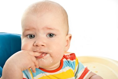 Little baby is feeding curds clipart