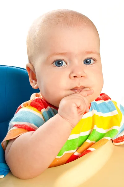 Little baby girl is sitting at the table — Stock Photo, Image