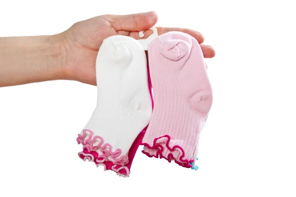 Completo de calcetines de bebé en la mano de mujer . —  Fotos de Stock