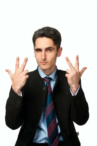 Молодой бизнесмен показывает ручные знаки . — стоковое фото