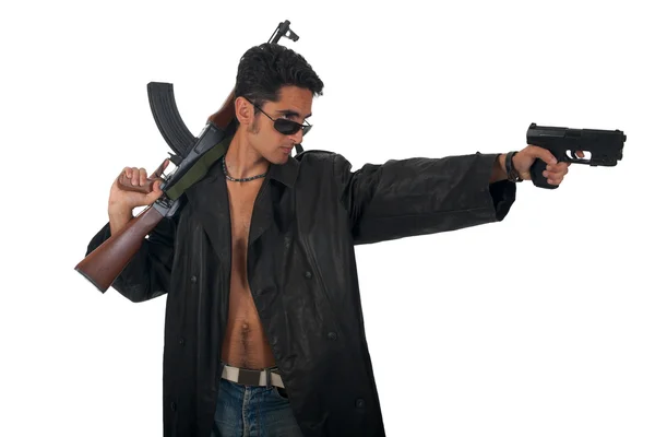 Handsome man with gun in leather raincoat. — Stock Photo, Image