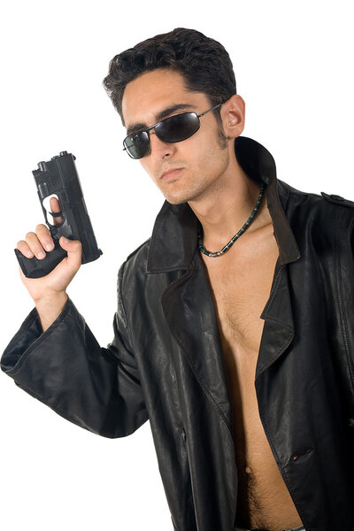 Handsome man with gun in leather raincoat