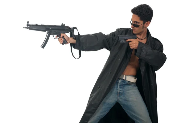 Handsome man with gun in leather raincoat. — Stock Photo, Image
