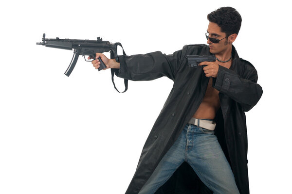 Handsome man with gun in leather raincoat.