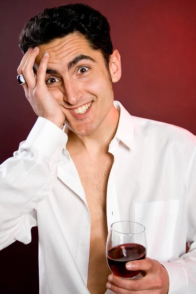 Glamour man with bocal of red wine. — Stock Photo, Image