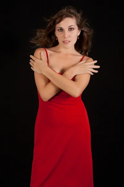 Sexy jonge vrouw in rode jurk. — Stockfoto