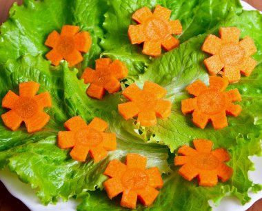 Lettuce and carrot cutting. clipart