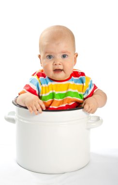 Baby sitting in the big saucepan. clipart