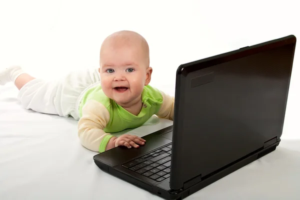 stock image Little baby with laptop.