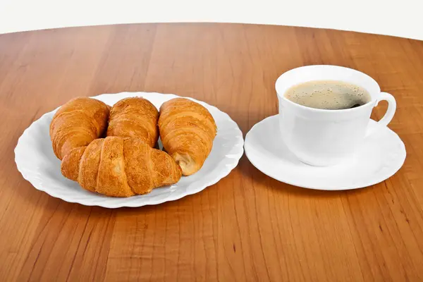 Újonnan sütött croissant és kávé. — Stock Fotó