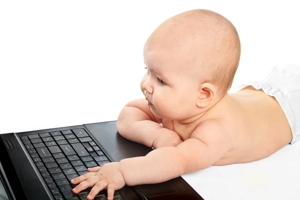 stock image Little baby with laptop.