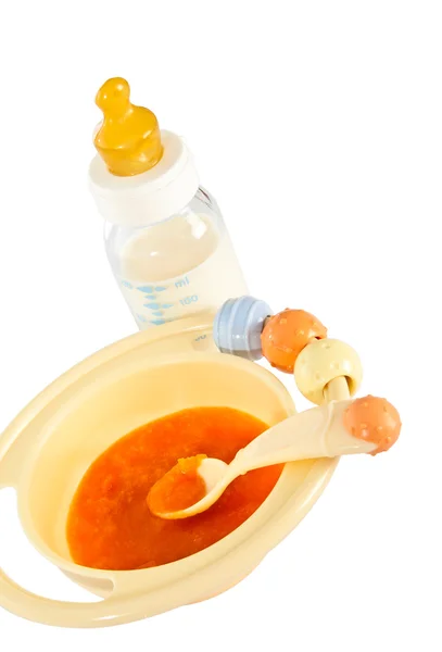 儿童板与南瓜粥和婴儿瓶. — 图库照片