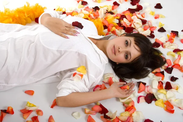 Beautiful girl in rose-petals — Stock Photo, Image