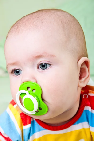 Baby girl with pacifier. — Stock Photo, Image