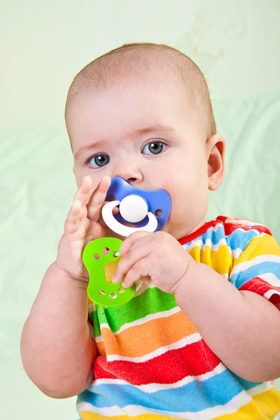Baby girl with pacifier. — Stock Photo, Image