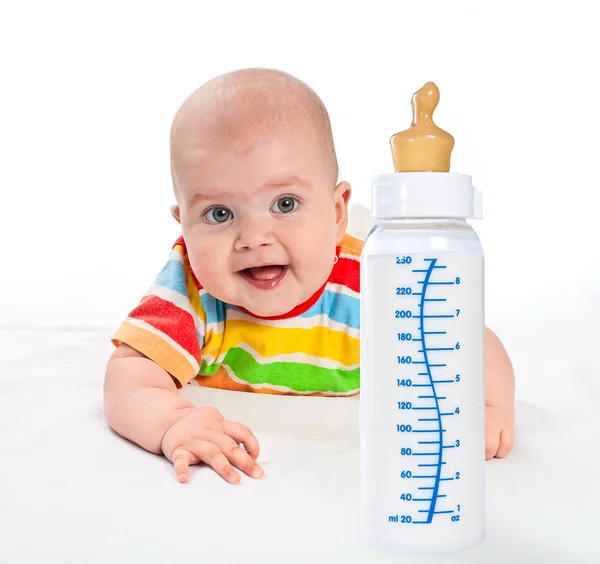 Little baby with milk bottle. — Stock Photo, Image